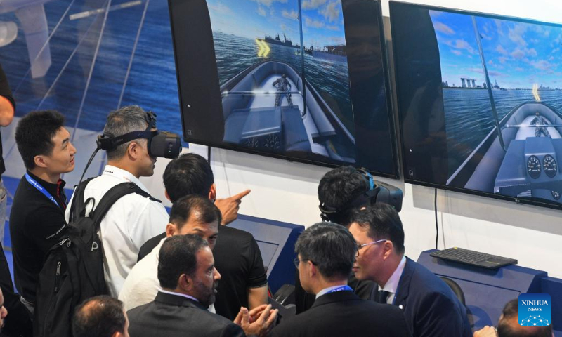 Military and defence delegates attend the International Maritime Defence Exhibition (IMDEX) Asia 2023 on its opening day in Singapore's Changi Exhibition Centre, May 3, 2023. (Photo by Then Chih Wey/Xinhua)