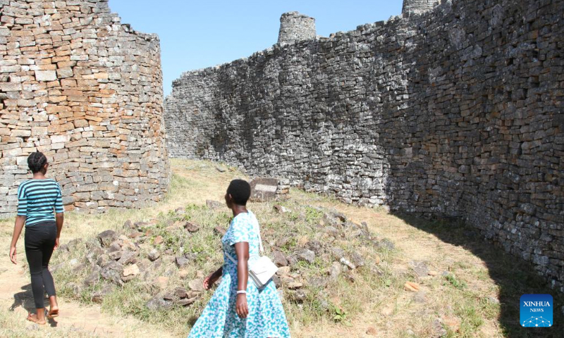 Tourists visit the Great Zimbabwe National Monument in Masvingo Province, Zimbabwe, May 5, 2023. The Great Zimbabwe National Monument was inscribed on the list of world cultural heritages by the UNESCO in 1986 and is one of Zimbabwe's greatest tourist attractions. (Xinhua/Zhang Baoping)