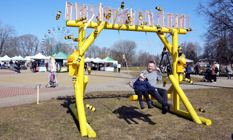 People enjoy themselves during the Swing festival in Sigulda, Latvia, April 8, 2023.(Photo: Xinhua)