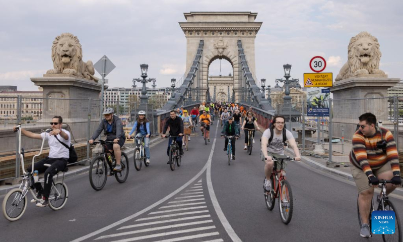People participate in a parade to promote bicycle as everyday transport in Budapest, Hungary on April 22, 2023. (Photo by Attila Volgyi/Xinhua)