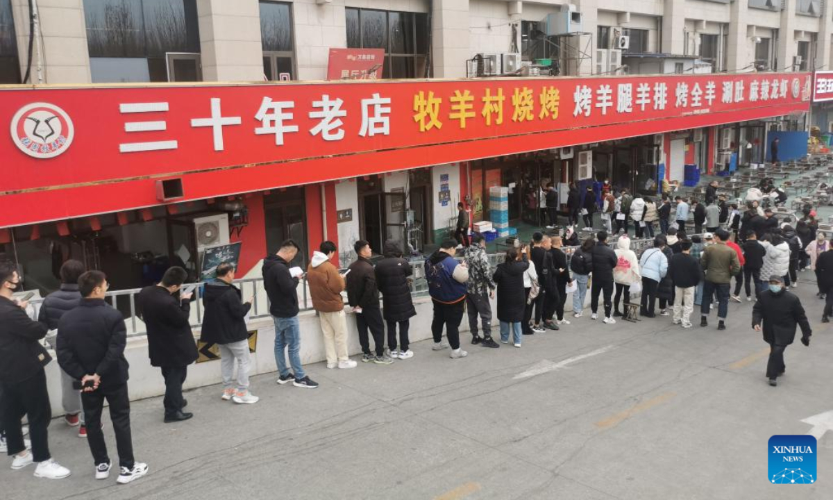 People queue up in front of a barbecue eatery in Zibo, east China's Shandong Province, March 16, 2023. Photo:Xinhua