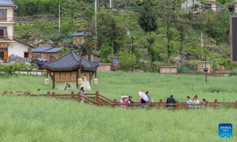 Tourists visit Longchi Village in Wuxi County, southwest China's Chongqing, May 2, 2023. China is witnessing a travel boom during this year's five-day May Day holiday. (Xinhua/Huang Wei)