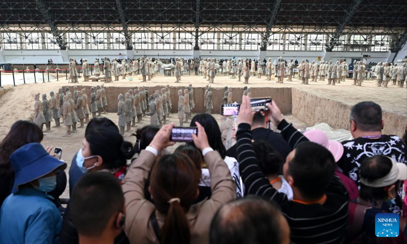 People visit pit No.1 of the Emperor Qinshihuang's Mausoleum Site Museum in Xi'an, northwest China's Shaanxi Province, April 26, 2023. The Emperor Qinshihuang Mausoleum and Terracotta Warriors were included in the World Heritage list by UNESCO in 1987. (Xinhua/Liu Xiao)