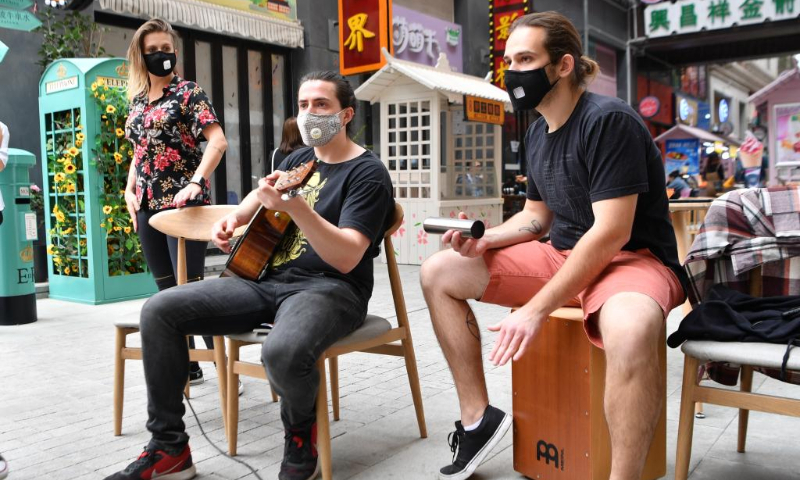 A Brazilian band performs in an outdoor show in Weiyang District of Xi'an, northwest China's Shaanxi Province, April 16, 2020. (Xinhua/Zhang Bowen)