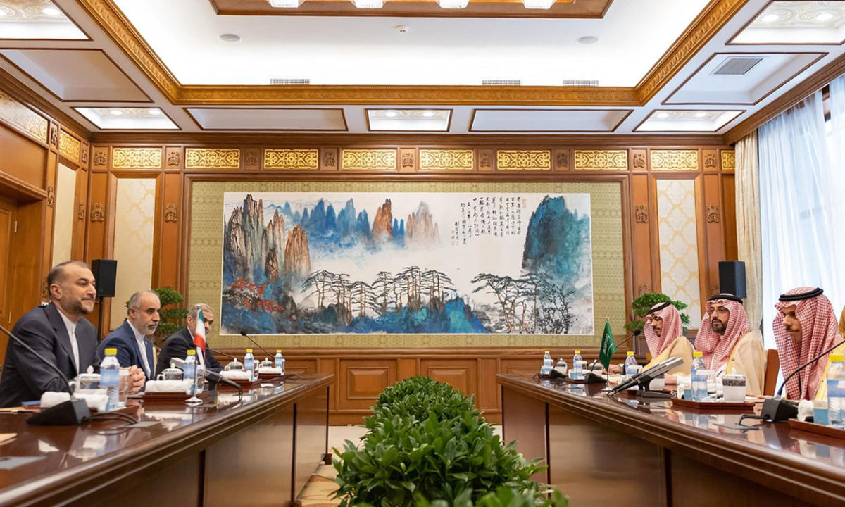 Iran’s Foreign Minister Hossein Amir-Abdollahian (left) and Saudi Foreign Affairs Minister Prince Faisal bin Farhan (right) attend a meeting with members of their delegations, in Beijing on April 6, 2023, paving the way for normalized ties under a China-brokered deal. Photo: VCG
