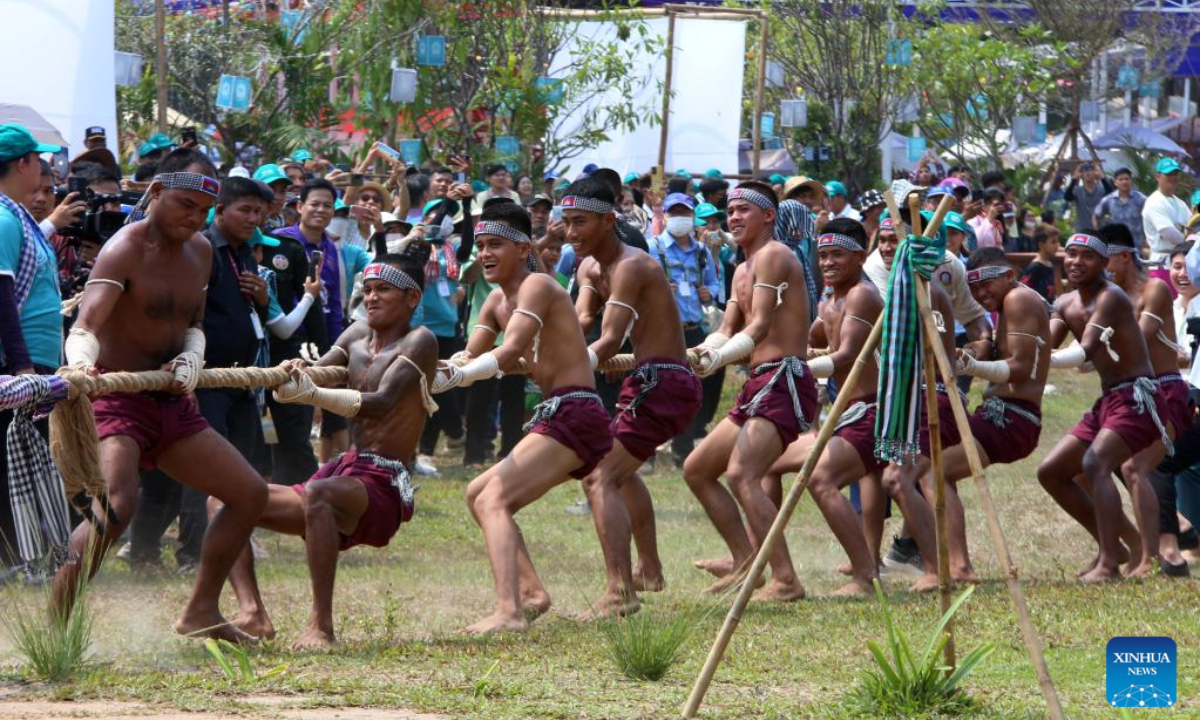 People play traditional tug-of-war game at the Sankranta festival in Siem Reap province, Cambodia on April 14, 2023. Cambodia kicked off the three-day Sankranta festival, or the Khmer New Year celebration, at the famed Angkor Archeological Park on Friday. Photo:Xinhua