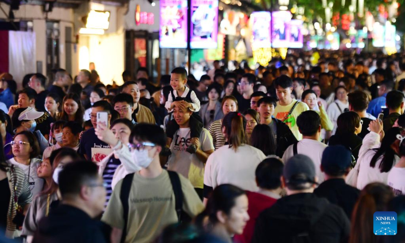Tourists visit the Qingming Bridge historical community in Wuxi, east China's Jiangsu Province, May 1, 2023. China is witnessing a travel boom during this year's five-day May Day holiday. (Photo by Huan Yueliang/Xinhua)