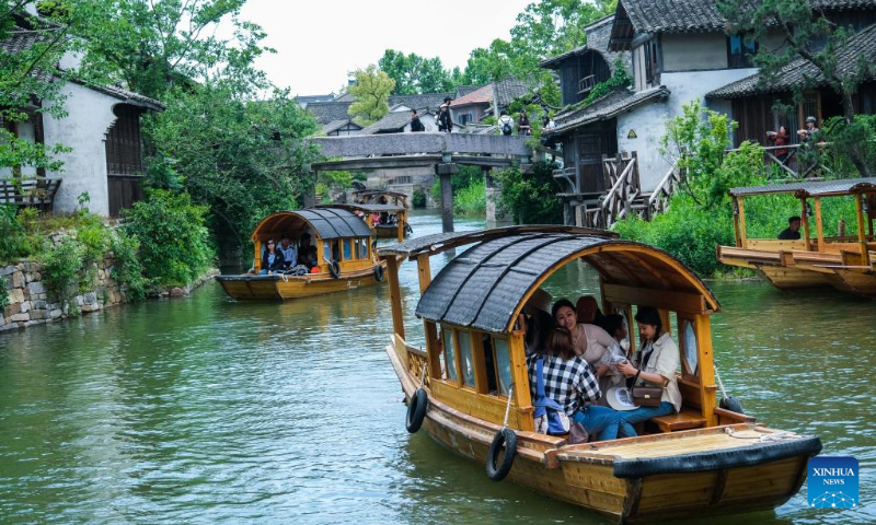 Tourists visit Puyuan Fashion Resort in Puyuan Town of Tongxiang City, east China's Zhejiang Province, May 2, 2023. (Xinhua/Xu Yu)