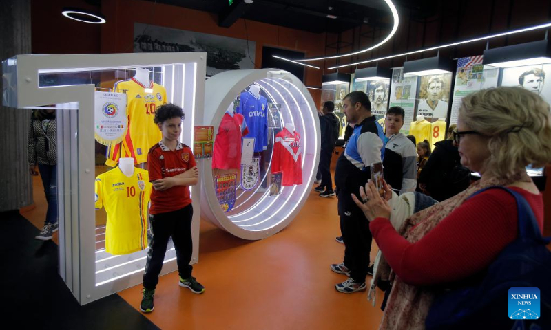 People visit the Football Museum which opens till late night as part of the European Night of Museums cultural initiative in downtown Bucharest, capital of Romania, May 13, 2023. (Photo by Cristian Cristel/Xinhua)
