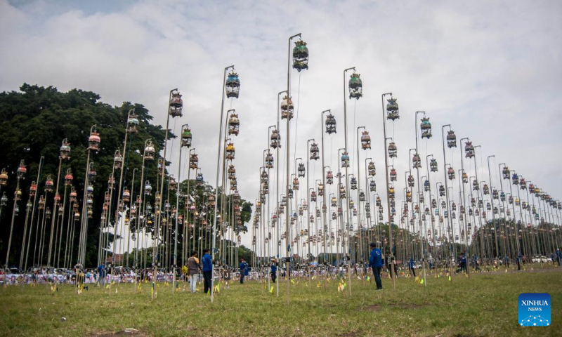 Judges give scores during a turtledove singing contest at Alun Alun Kidul in Yogyakarta, Indonesia, May 6, 2023. (Photo by Agung Supriyanto/Xinhua)
