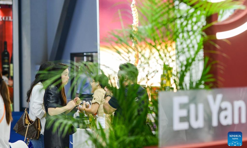 People visit the booth of Singaporean traditional Chinese medicine maker Eu Yan Sang at the third China International Consumer Products Expo (CICPE) in Haikou, south China's Hainan Province, April 12, 2023. The third China International Consumer Products Expo held in the southern province of Hainan has seen active participation from enterprises of the Regional Comprehensive Economic Partnership (RCEP) member countries, such as Japan, South Korea, Australia, and Thailand. (Photo: Xinhua)