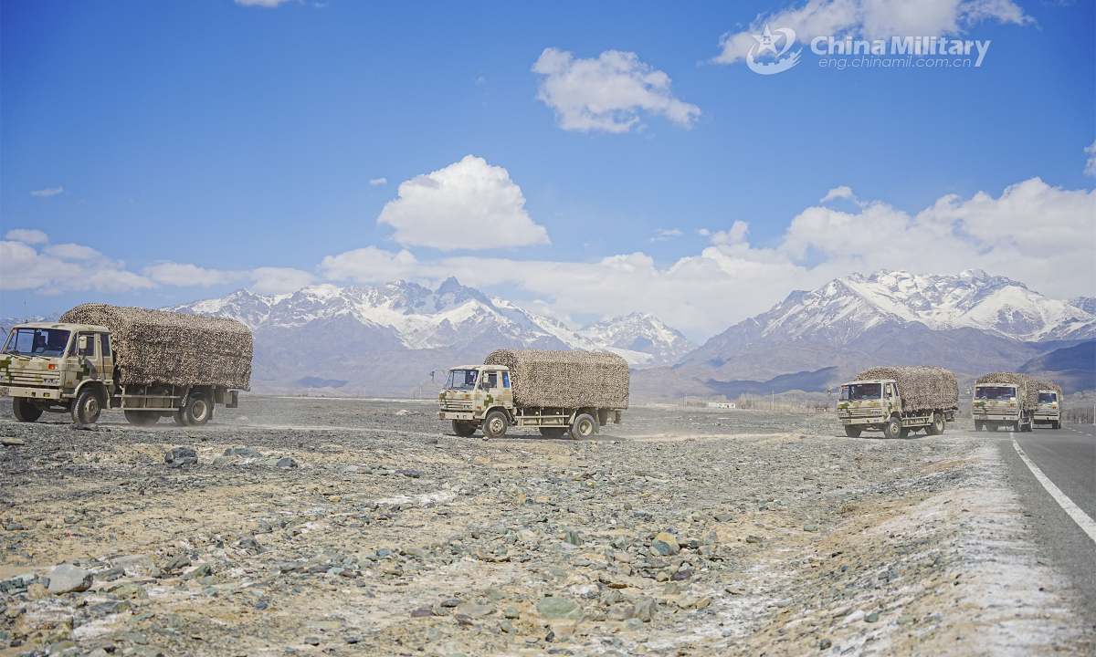 A convoy of military trucks attached to a regiment under the PLA Xinjiang Military Command marches forward with weapons and equipment en route to the training field during a recent long-distance maneuver operation. Photo: China Military