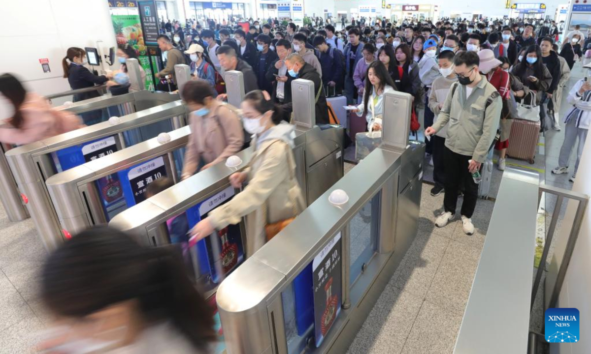 Passengers have their tickets checked at the waiting hall of the Xuzhou East Railway Station in Xuzhou, east China's Jiangsu Province, April 29, 2023. A travel rush is on as the country ushers in the 5-day Labor Day holiday on Saturday. Photo:Xinhua