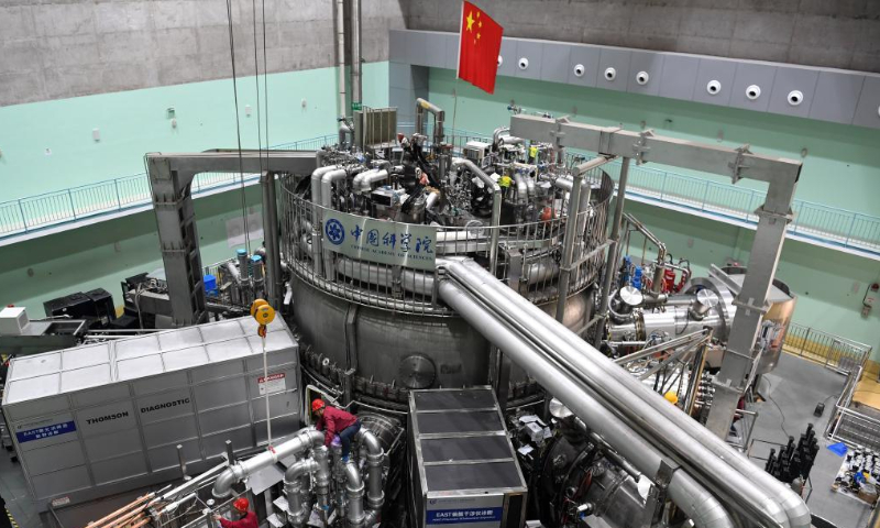Staff members perform an upgrade to the experimental advanced superconducting tokamak (EAST) at the Hefei Institutes of Physical Science under the Chinese Academy of Sciences (CAS) on April 13, 2021. Photo: Xinhua