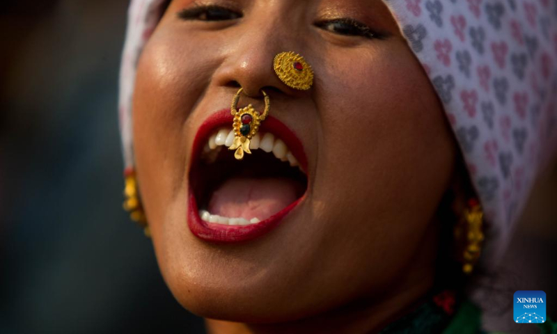 A woman in traditional attire is pictured during the celebration of the Ubhauli festival in Kathmandu, Nepal, May 13, 2023. (Photo by Sulav Shrestha/Xinhua)