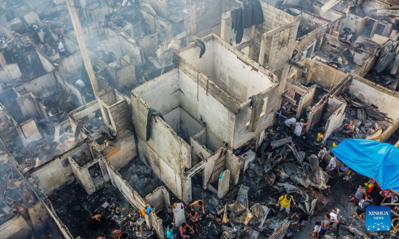 This areial photo taken on May 14, 2023 shows damaged houses after an early morning fire at a slum area in Manila, the Philippines. (Xinhua/Rouelle Umali)