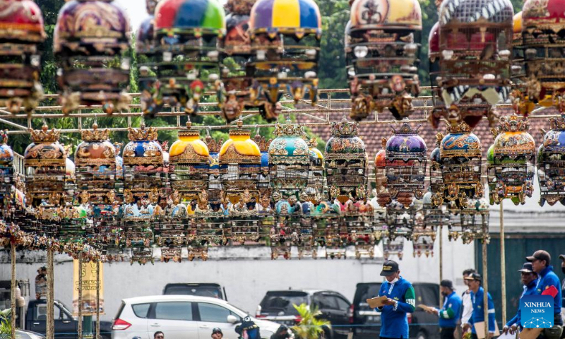 Judges give scores during a turtledove singing contest at Alun Alun Kidul in Yogyakarta, Indonesia, May 6, 2023. (Photo by Agung Supriyanto/Xinhua)