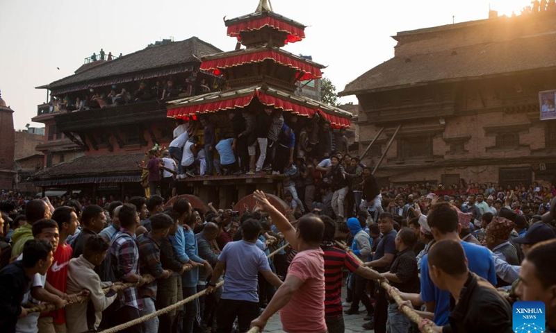People pull the chariot of Lord Bhairav during the first day of the Bisket Jatra Festival at Bhaktapur Durbar Square in Bhaktapur, Nepal, April 10, 2023. The festival is celebrated annually to welcome the arrival of spring and the start of Nepali New Year.(Photo: Xinhua)