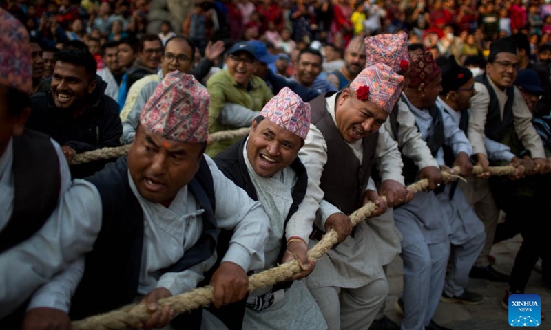 People pull the chariot of Lord Bhairav during the first day of the Bisket Jatra Festival at Bhaktapur Durbar Square in Bhaktapur, Nepal, April 10, 2023. The festival is celebrated annually to welcome the arrival of spring and the start of Nepali New Year.(Photo: Xinhua)