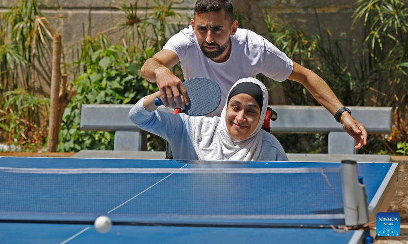 Participants play table tennis in celebration of World Table Tennis Day in Beirut, Lebanon, on April 23, 2023. (Xinhua/Bilal Jawich)