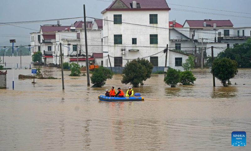 Rescuers carry out rescue operations in Shangshan Village of Licun Township, Fengcheng City, east China's Jiangxi Province, May 6, 2023. China's State Flood Control and Drought Relief Headquarters launched a level-IV emergency response for flood control Saturday as heavy rains lashed parts of east China's Jiangxi Province. (Xinhua/Wan Xiang)