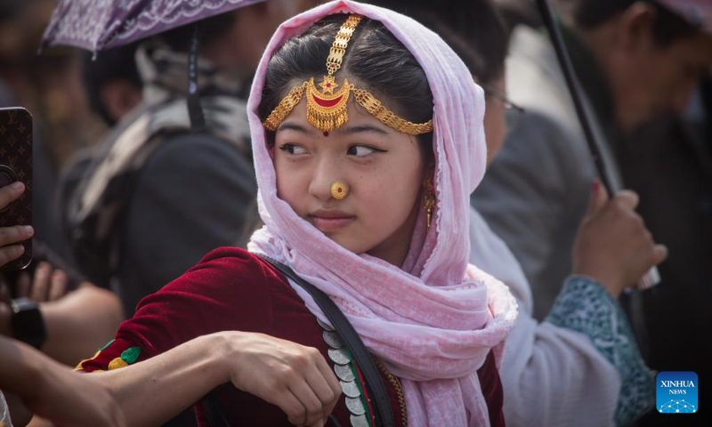A woman from the Kirat community is pictured during the celebration of the Ubhauli festival in Kathmandu, Nepal, May 13, 2023. (Photo by Hari Maharjan/Xinhua)