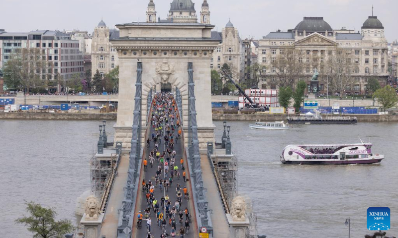 People participate in a parade to promote bicycle as everyday transport in Budapest, Hungary on April 22, 2023. (Photo by Attila Volgyi/Xinhua)