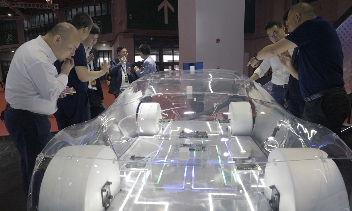 Visitors look at the car smart driving chip developer Semidrive's transparent concept car at the exhibition on April 18, 2023. Photo: Lu Ting/GT