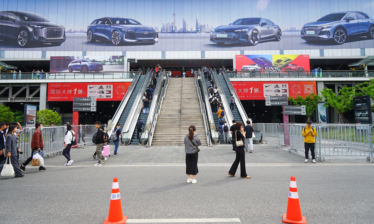 Visitors prepare to enter the National Exhibition and Convention Center (Shanghai) for visiting the auto show. Photo: Lu Ting/GT