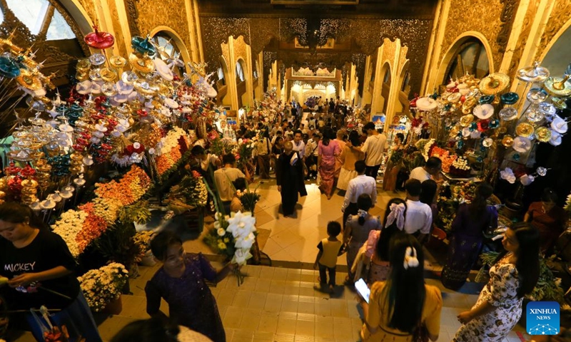 People visit the Shewdagon Pagoda on the first day of the Myanmar calendar New Year in Yangon, Myanmar, April 17, 2023.(Photo: Xinhua)