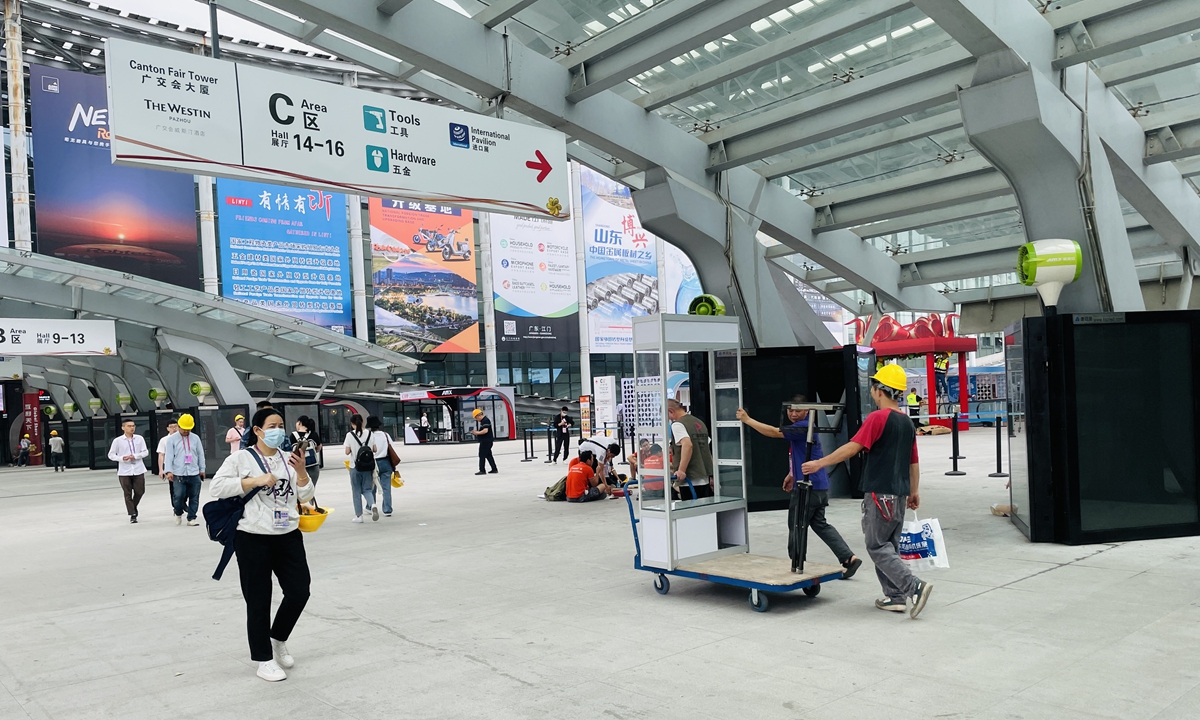 Employees are seen transporting material for booths at the exhibition hall of the Canton Fair, on April 13, 2023. Photo: Chi Jingyi/GT