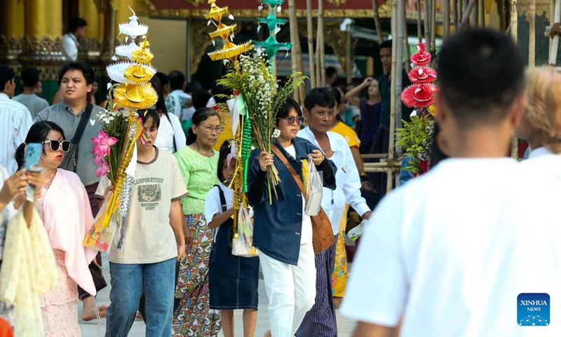 People visit the Shewdagon Pagoda on the first day of the Myanmar calendar New Year in Yangon, Myanmar, April 17, 2023.(Photo: Xinhua)