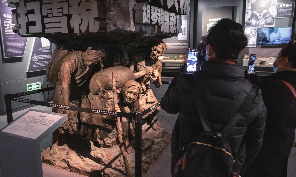 Visitors view a sculpture showing the miserable life of serfs in old Xizang in the Tibet Museum in Lhasa, Southwest China's Xizang Autonomous Region. Photo: VCG