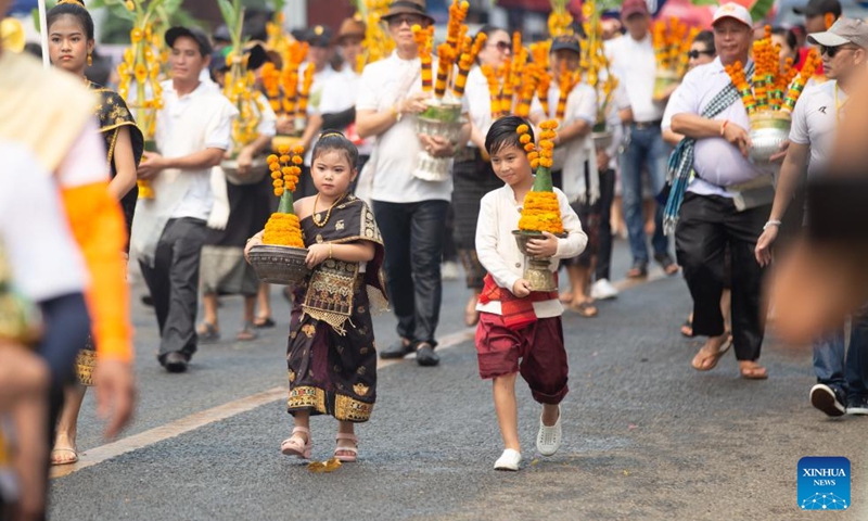Children participate in the celebration of the Songkran Festival or the Lao New Year, in Luang Prabang, Laos, April 16, 2023. The Lao New Year, celebrated from April 14 to 16, is the most important festival in the Lao calendar and also a time of endless fun for the Laotians. (Photo by Kaikeo Saiyasane/Xinhua)