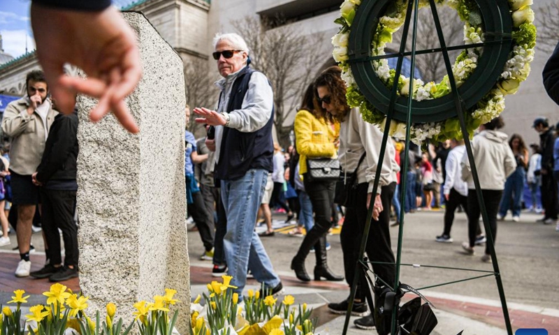 People mourn the victims of the Boston Marathon bombings in Boston, the United States, April 15, 2023. April 15, 2023 marks the 10-year anniversary of the Boston Marathon Bombings back in 2013.
On April 15, 2013, two bombs went off near the finish line of the Boston Marathon, killing three people and wounded more than 260 others. (Photo by Ziyu Julian Zhu/Xinhua)