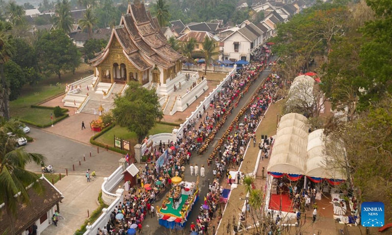 This aerial photo shows people celebrating the Songkran Festival or the Lao New Year, in Luang Prabang, Laos, April 15, 2023. The Lao New Year, celebrated from April 14 to 16, is the most important festival in the Lao calendar and also a time of endless fun for the Laotians. (Photo by Kaikeo Saiyasane/Xinhua)