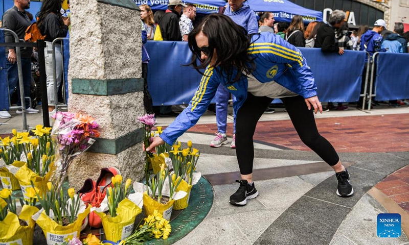 A woman places flowers at the memorial site of the Boston Marathon bombings in Boston, the United States, April 15, 2023. April 15, 2023 marks the 10-year anniversary of the Boston Marathon Bombings back in 2013.
On April 15, 2013, two bombs went off near the finish line of the Boston Marathon, killing three people and wounded more than 260 others. (Photo by Ziyu Julian Zhu/Xinhua)