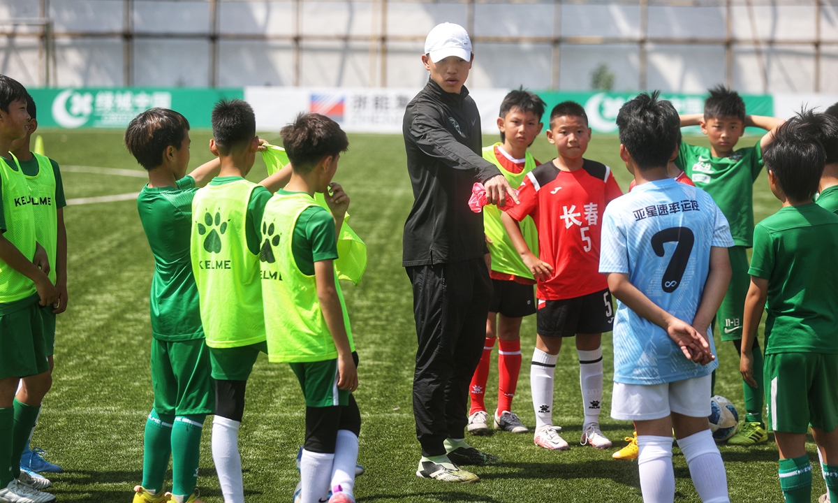 A coach instructs young players at the Zhejiang FC youth academy in Hangzhou, Zhejiang Province. Photo: Cui Meng/Global Times 