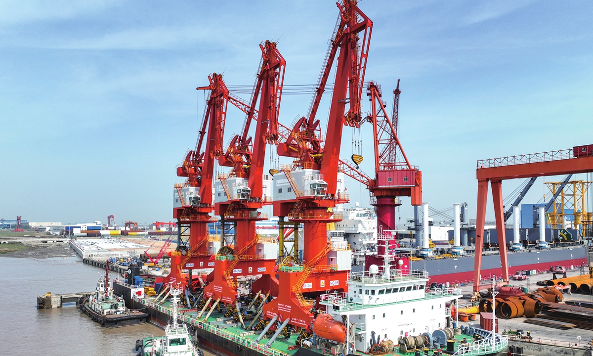 Three MQ4035 portal cranes set sail from the Huazi Qidong Wharf in East China's Jiangsu Province on April 19, 2023. The cranes, manufactured by a local company, are being shipped to Indonesia for a Belt and Road Initiative project that involves nickel ore loading and unloading. Photo: cnsphoto
