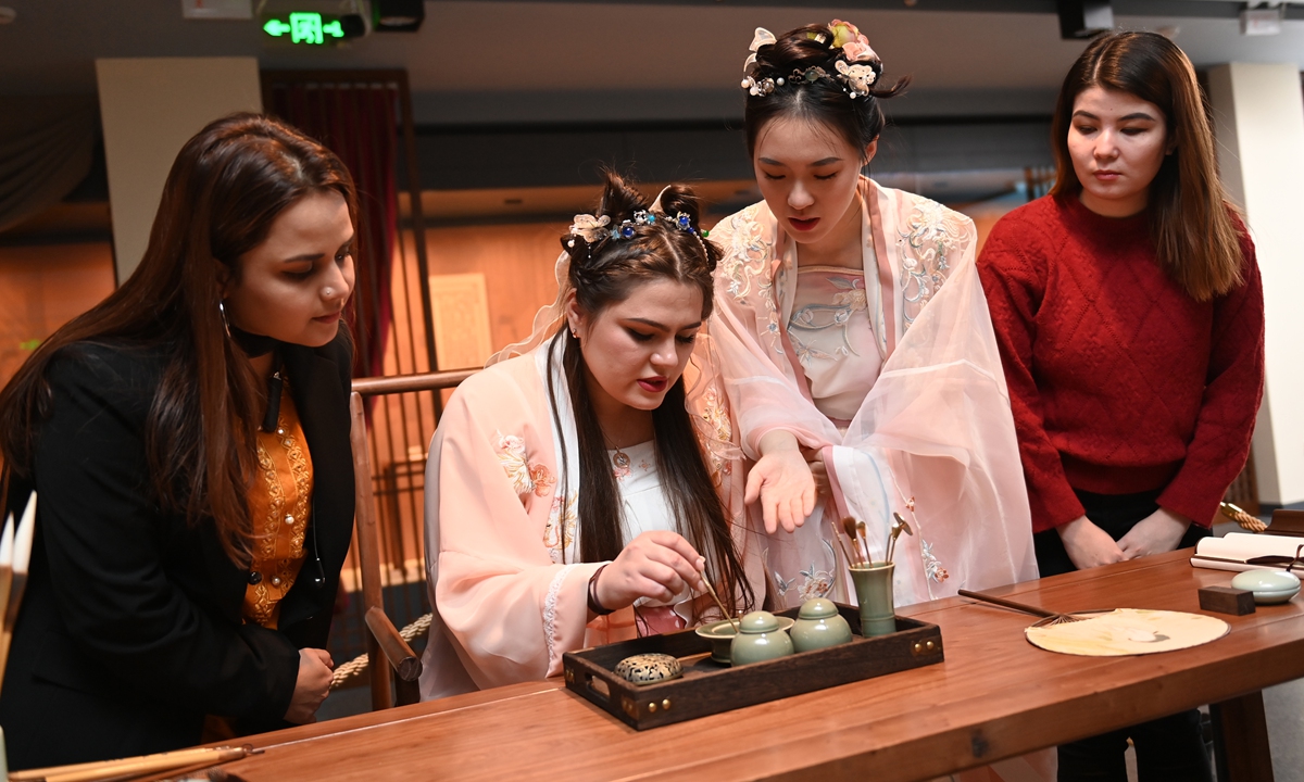 A Chinese student (second from right) teaches international students to burn incense, in an activity to mark International Chinese Language Day on April 20, 2023, in Jilin University in Changchun, Northeast China's Jilin Province. Photo: IC