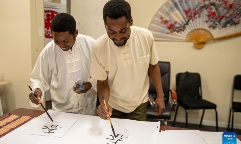 Students write Chinese calligraphy during an event celebrating the upcoming UN Chinese Language Day at the Confucius Institute at the University of Johannesburg in Johannesburg, South Africa, on April 19, 2023.(Photo: Xinhua)