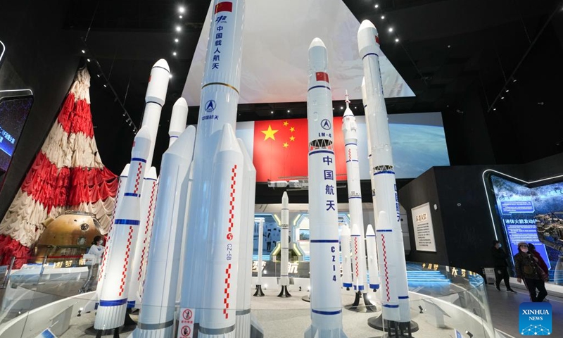 Visitors view models of the Long March series carrier rockets at the China Space Museum in Beijing, capital of China, April 24, 2023. After its renovation, the China Space Museum reopened to the public on the occasion of the Space Day of China on Monday. The museum features exhibition sections covering such themes as carrier rockets, satellites and manned spaceships, exposing visitors to the development of China's aerospace industry.(Photo: Xinhua)