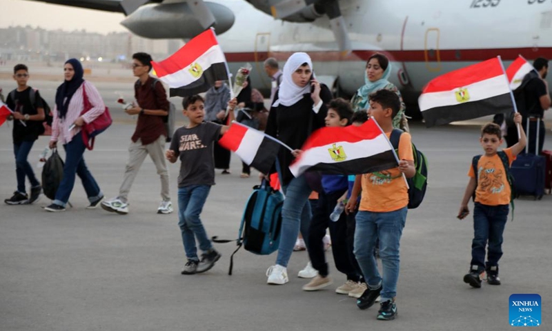 Egyptian nationals evacuated from Sudan arrive at an airport in Cairo, Egypt, April 24, 2023. The Egyptian authorities evacuated on Sunday 436 Egyptian nationals from Sudan as fierce fighting continues in the neighboring country.(Photo: Xinhua)
