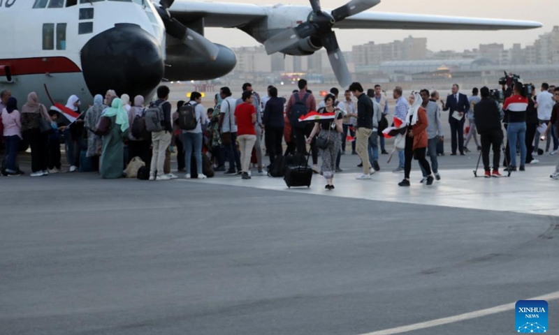 Egyptian nationals evacuated from Sudan arrive at an airport in Cairo, Egypt, April 24, 2023. The Egyptian authorities evacuated on Sunday 436 Egyptian nationals from Sudan as fierce fighting continues in the neighboring country.(Photo: Xinhua)
