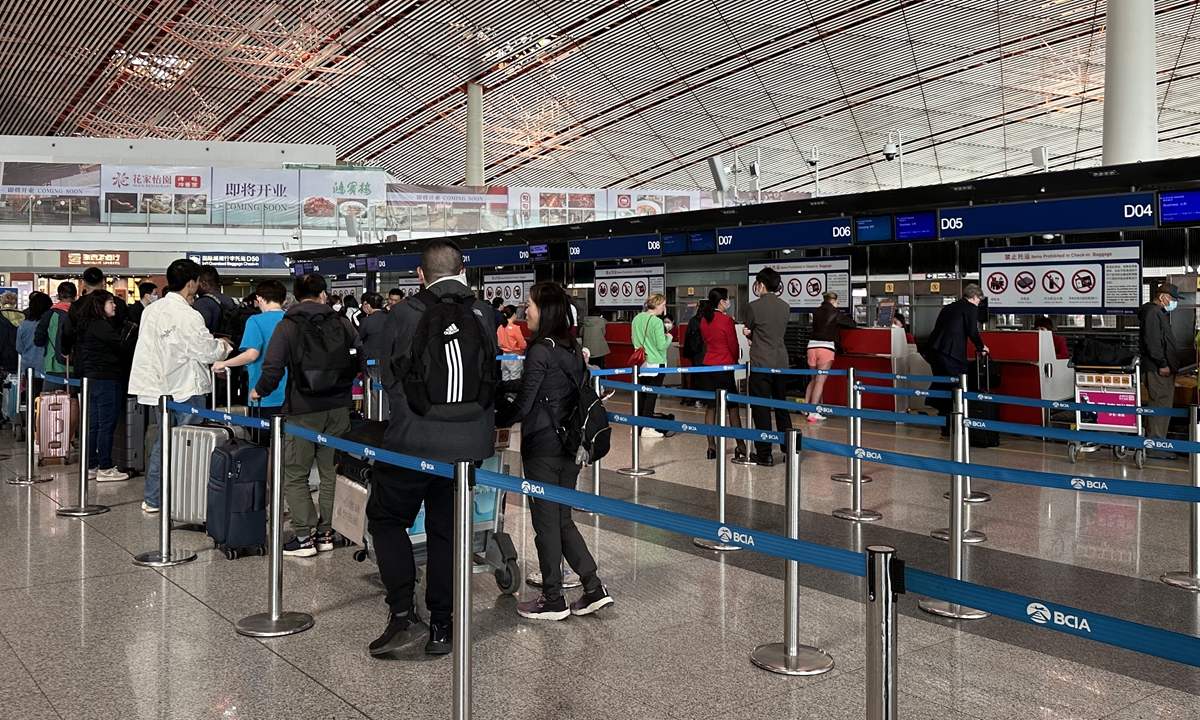 Passengers line up in the Beijing Capital International Airport on April 26, 2023. Photo: Tu Lei/GT