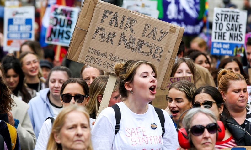 Health workers demonstrate in central London, Britain, on May 1, 2023. Health workers in the United Kingdom (UK) staged fresh walkouts on Monday over pay and conditions, after unions rejected the government's pay offer last month. (Xinhua)