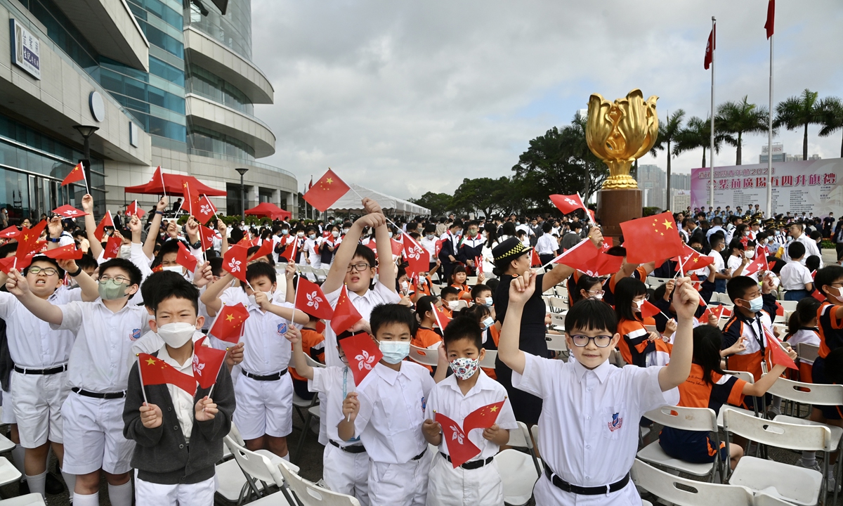 

Students in the Hong Kong Special Administrative Region take part in the flag-raising ceremony of the National Youth Day at Golden Bauhinia Square in Hong Kong on May 4, 2023. The ceremony was held to commemorate the 104th anniversary of the May Fourth Movement and to cultivate patriotism among young people. The event was held by the Committee of Youth Activities of Hong Kong, and co-organized by various organizations and groups. Photo: VCG