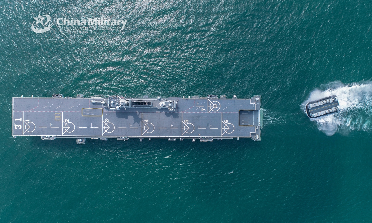 An air-cushioned landing craft attached to a naval landing ship flotilla under the People's Liberation Army Southern Theater Command prepares to enter the well deck of the amphibious assault ship Hainan (Hull 31) during a maritime real-combat training exercise recently. Photo: eng.chinamil.com.cn