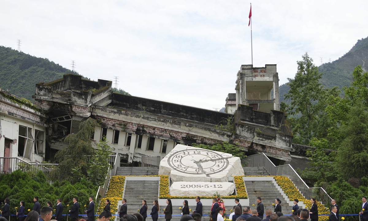A memorial ceremony is held near a site that a junior high school collapsed during the magnitude-8.0 Wenchuan earthquake in 2008 in the county in Southwest China's Sichuan on May 12, 2023, marking 15th anniversary of the disaster which left more than 69,000 dead and almost 18,000 missing. Photo: VCG