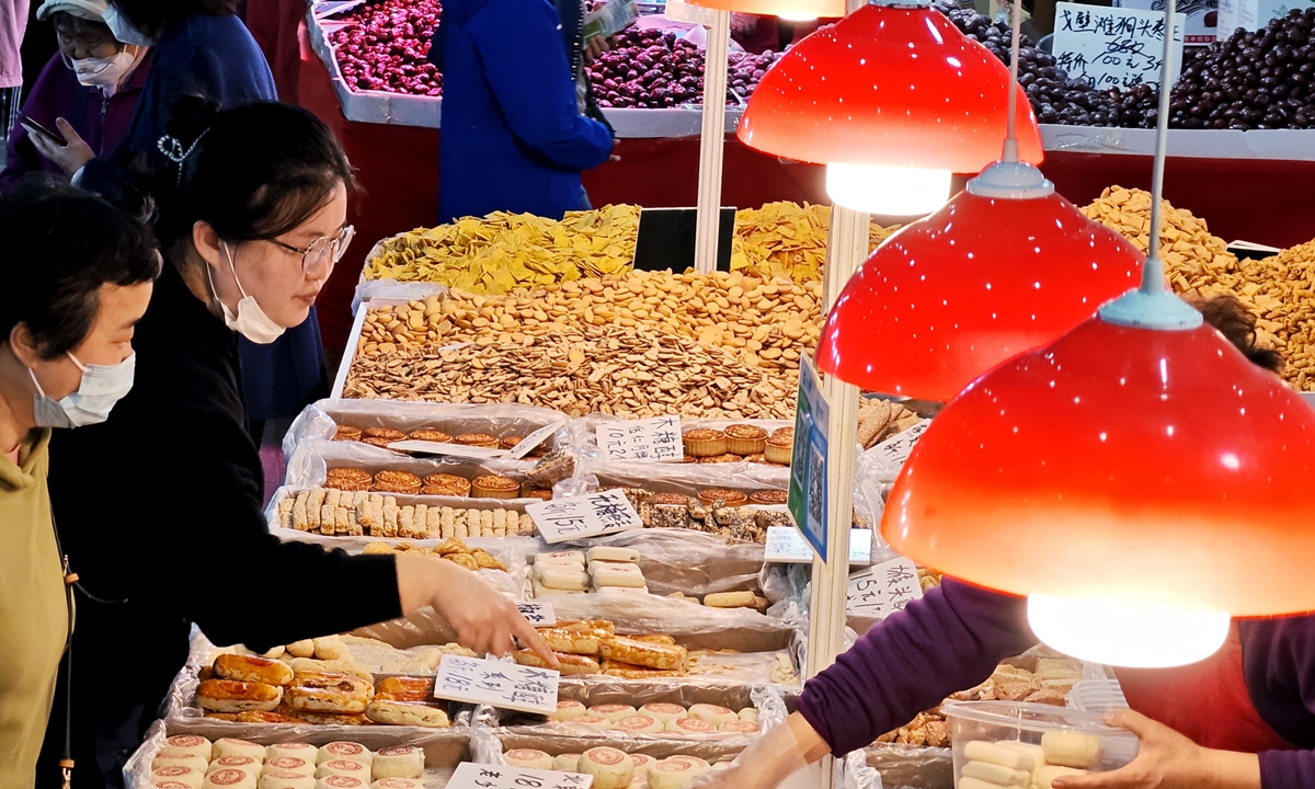 People shop at a food exhibition in Dalian, Northeast China's Liaoning Province on May 7, 2023. The country is sparing no effort to increase consumption, as official data showed that retail sales went up 5.8 percent year-on-year in the first quarter of this year. Photo: VCG